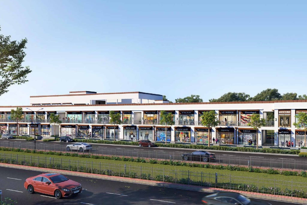 Architectural render of a two-level retail arcade along a landscaped main road